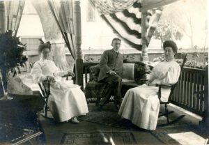 The Horton Family enjoys the covered front porch of their house on Pleasant Street. Click on image to view in closer detail.